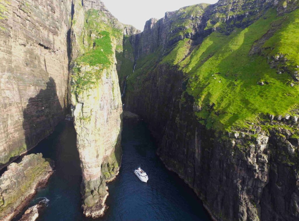 a ship in Vestmanna sea cliffs, Faroe Islands