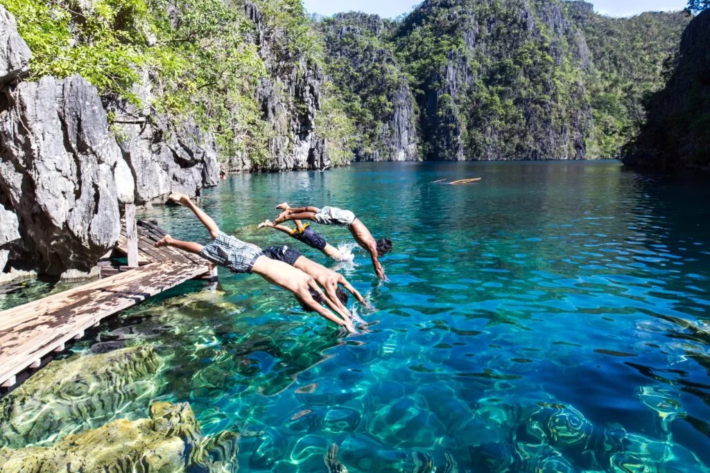 guys jumping on Kayangan Lake