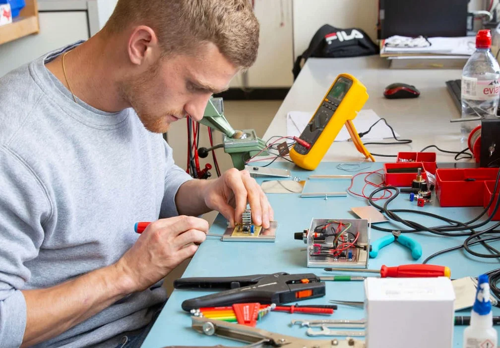 electronic hobbyist on workbench