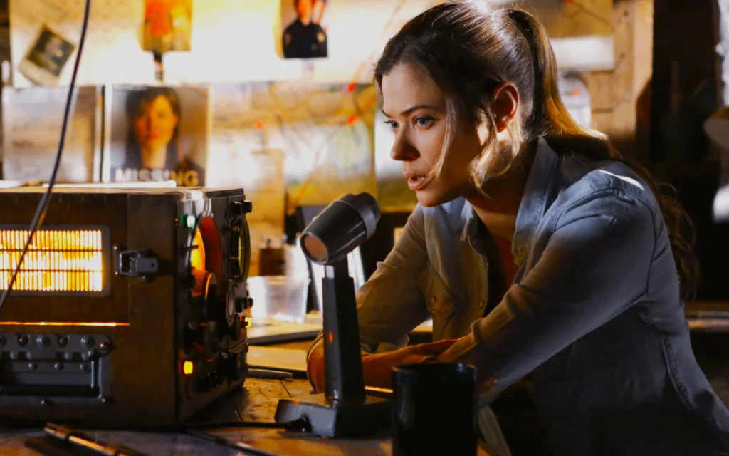 woman speaking on radio desk mic