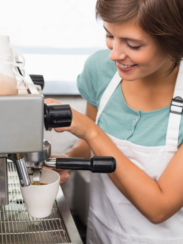 pretty-barista-making-coffee-smiling-at-camera-at-2023-11-27-05-35-59-utc