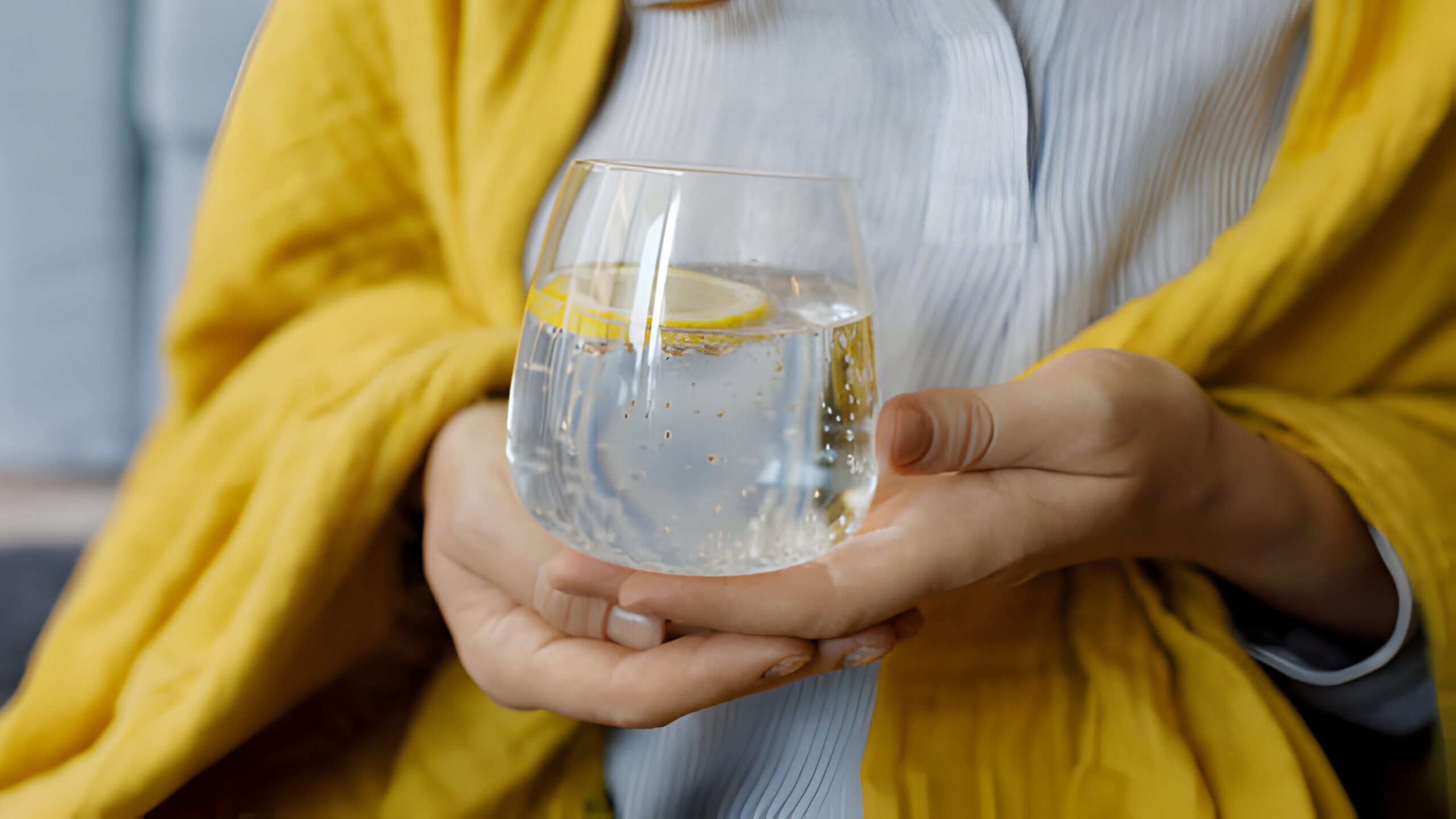 sparkling water-lady holding a glass of water